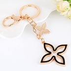 Alloy Four Leaf Clover Keychain Gold Tone with Black Enamel Accent