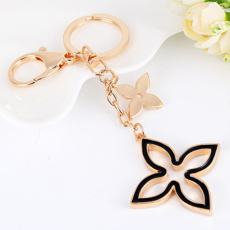 Alloy Four Leaf Clover Keychain Gold Tone with Black Enamel Accent
