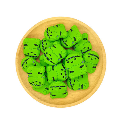 Silicone Focal Beads Frankenstein Inspired Black Stitch Marks Holding Pose 2