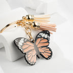 Metal Butterfly Keychain with Peach Gray Wings and Suede Tassels