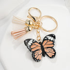 Metal Butterfly Keychain with Peach Gray Wings and Suede Tassels 2