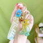 Acrylic Gradient Luminous Dinosaur Keychain with Bell Charm 9