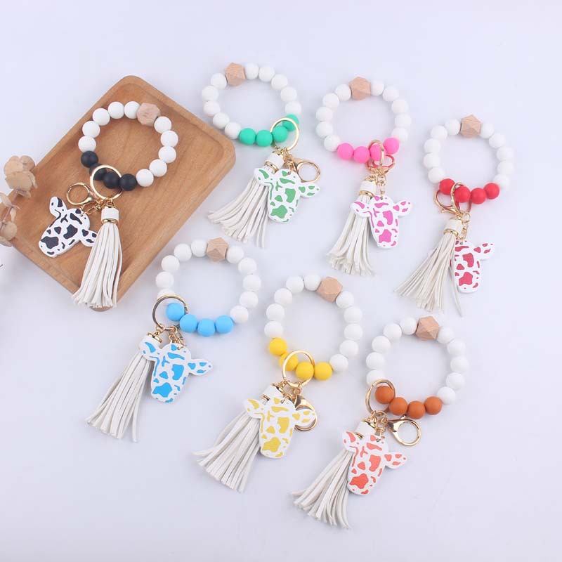 Silicone Beaded Wristlet Keychain with Leather Tassel and Cow Print Charm