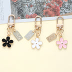 Enamel Metal Daisy Keychain Gold Outline Black White Pink