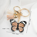 Metal Butterfly Keychain with Peach Gray Wings and Suede Tassels 5